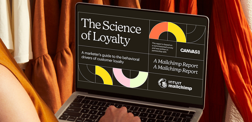 Person on a Laptop viewing The Science of Loyalty Playbook by Mailchimp in partnership with Canvas8